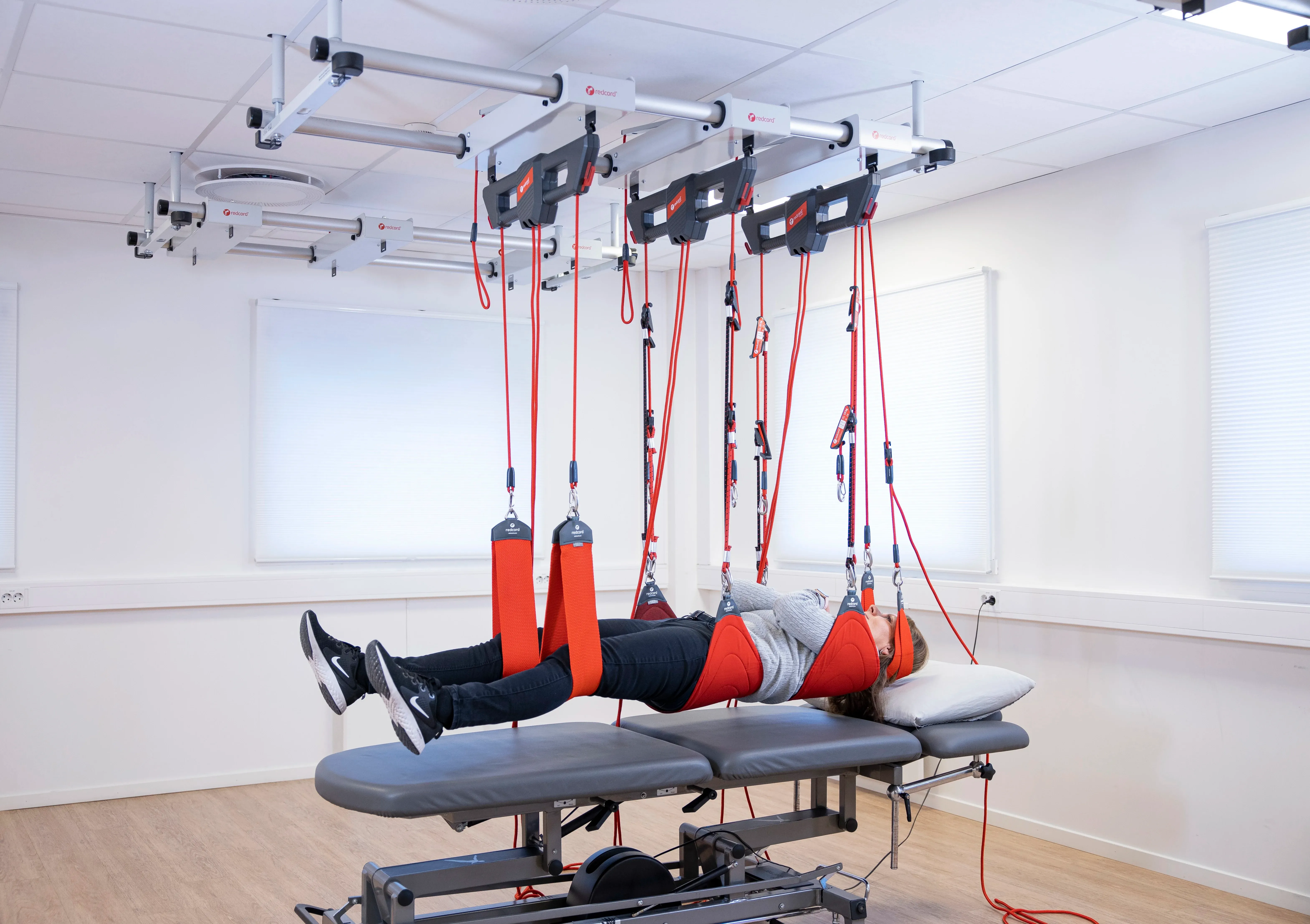 The Redcord Workstation Professional configured in a bright clinic room